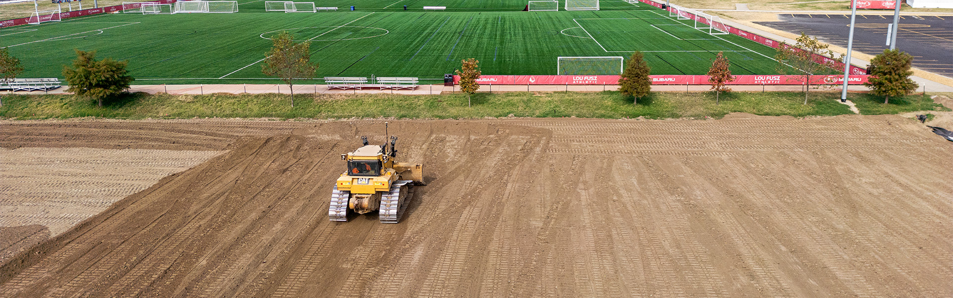 a bulldozer on a dirt field