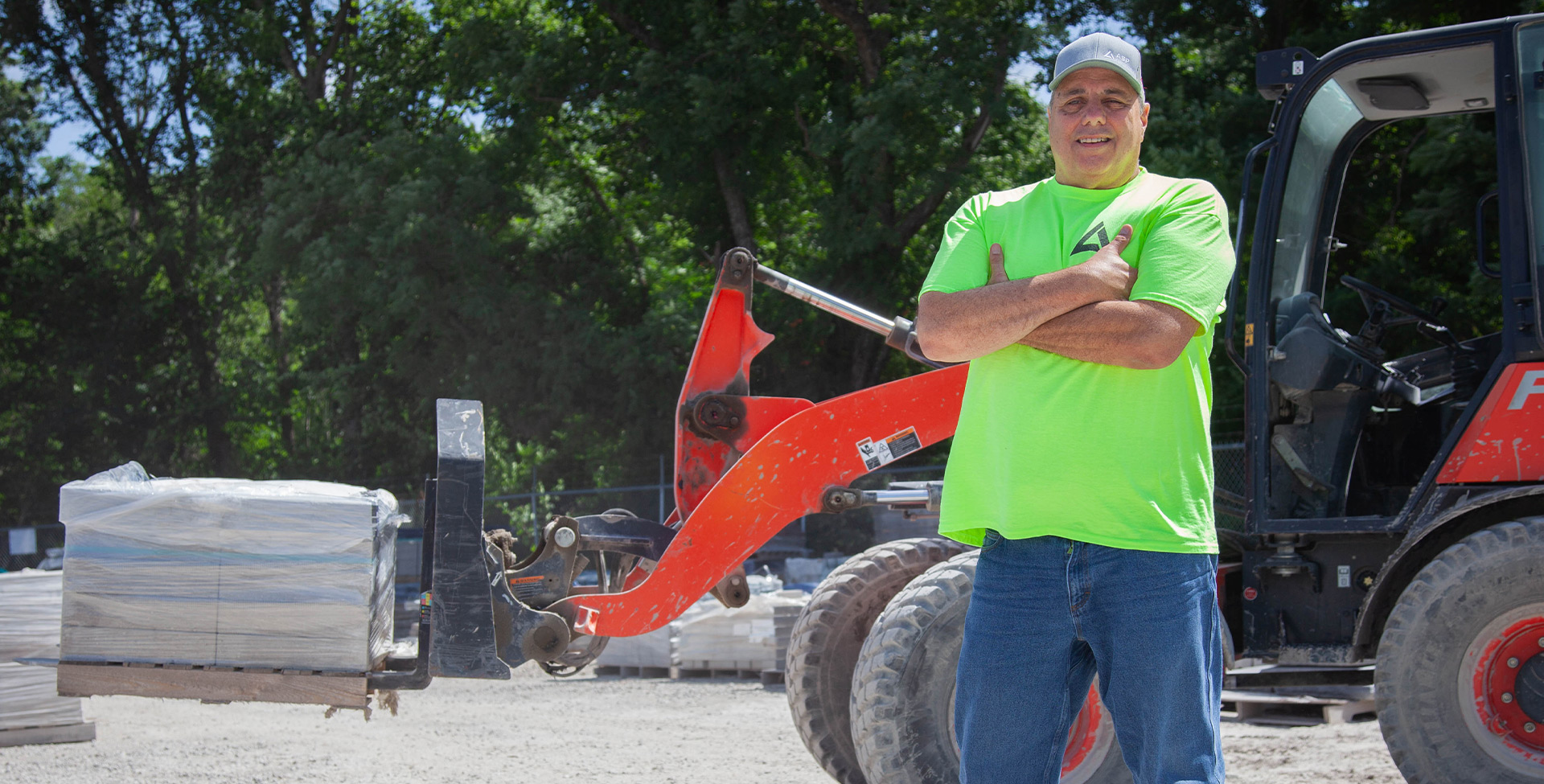 a man standing next to a tractor